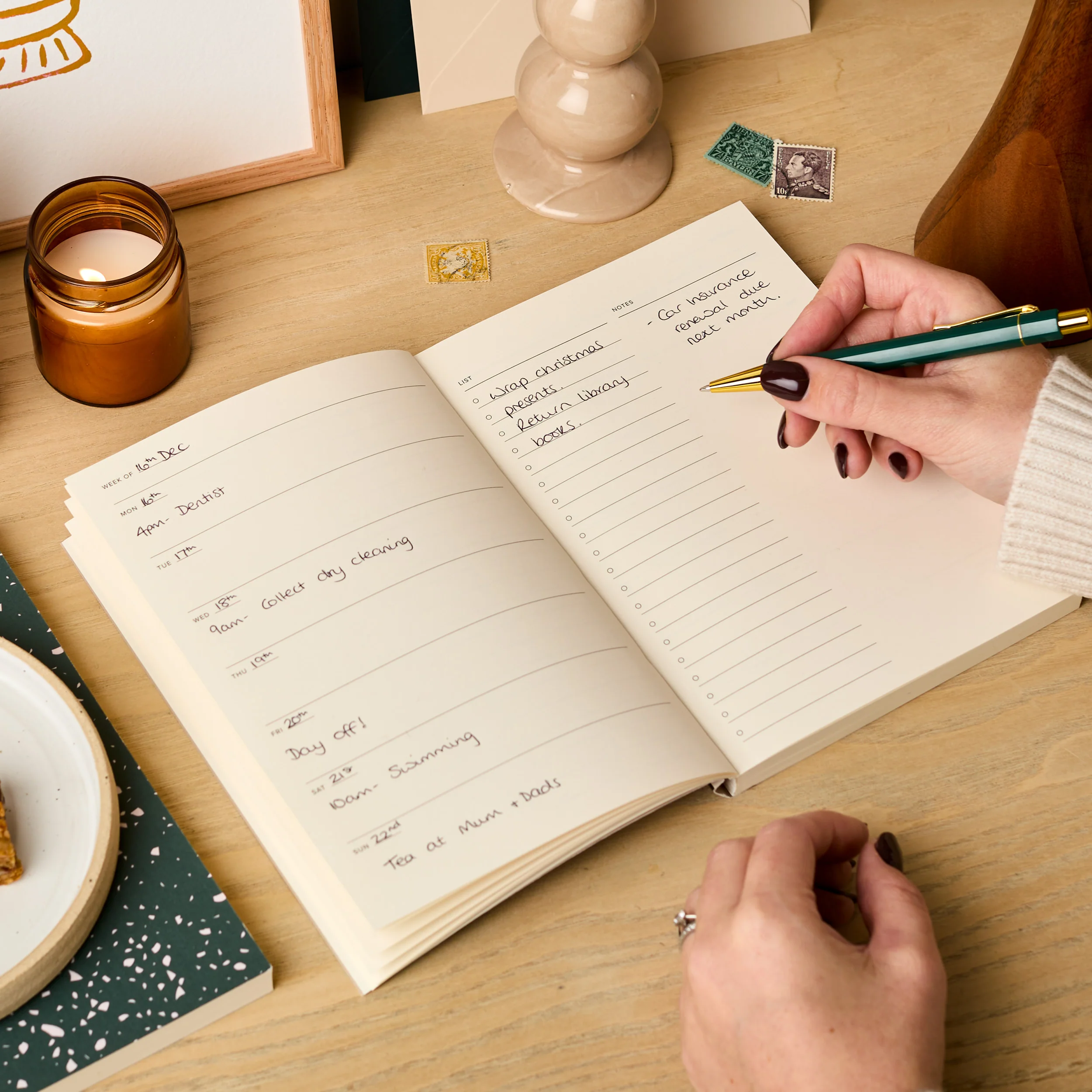 A handwritten weekly planner with soft evening light across the page